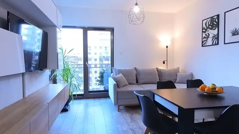 Living room, dining area and kitchen — a still from the 360° tour of the flat at 17 Lema St, Gdańsk