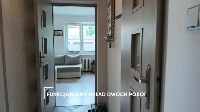 Film still with the caption “Functional two-room layout”